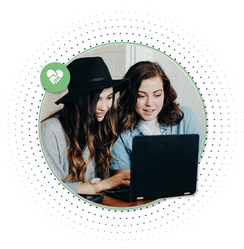 Two women working on a laptop Diversity Sector